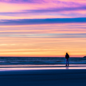 man looking at the sunset